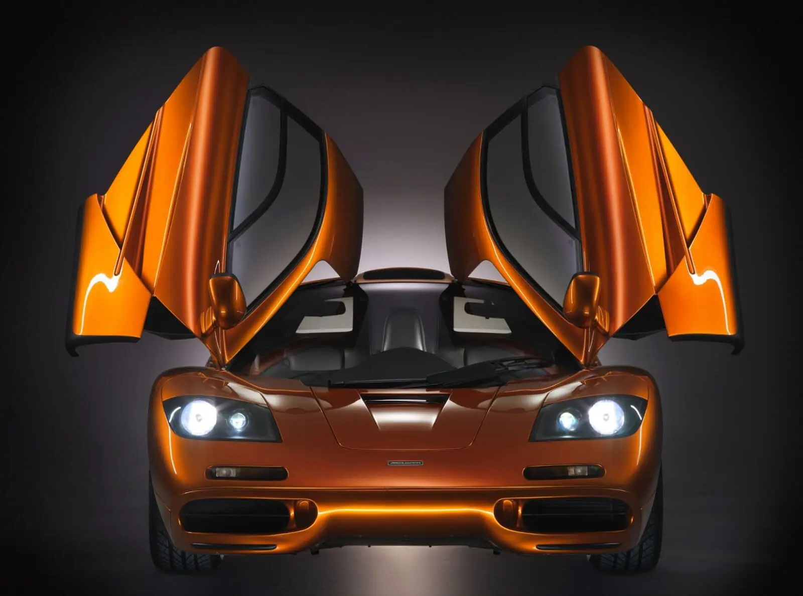 A McLaren F1 with its doors raised