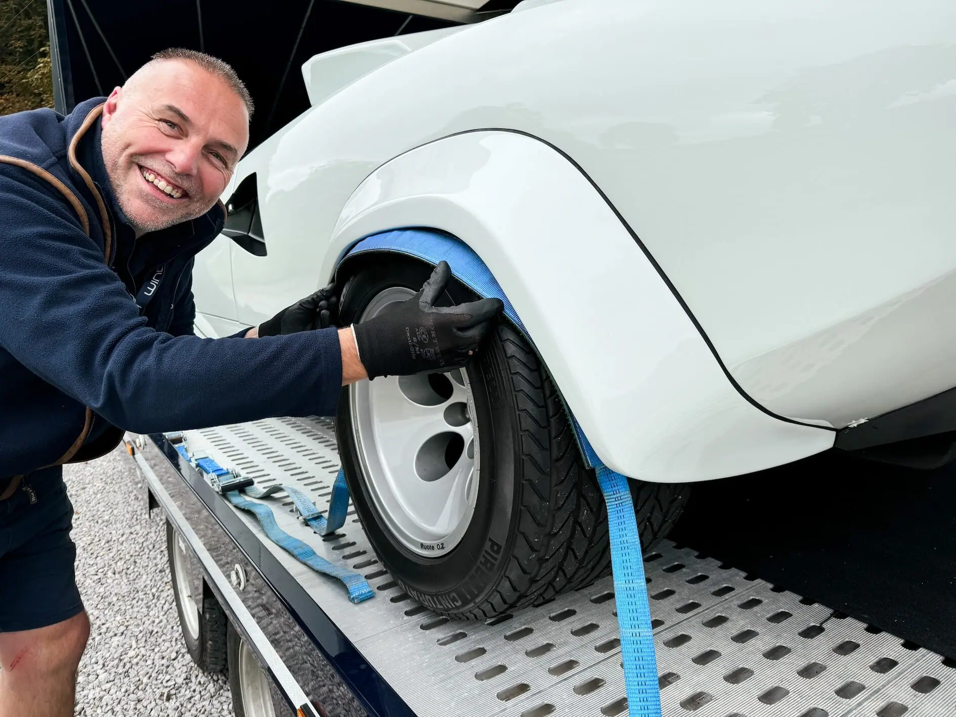 Securing a wheel strap in the transporter