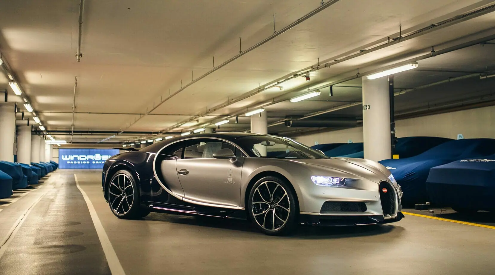 A Bugatti Veyron among covered cars